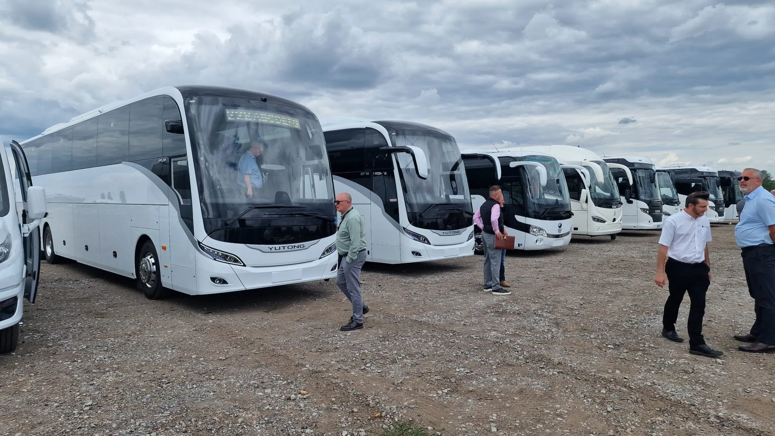 RANGE OF YUTONG DISEL AND ELECTRIC COACHES SUCH AS GT12,TC9,GTE14 IN A ROW ON AN AIRFIELD AT CPT RIDE & DRIVE. PELICAN BUS + COACH
